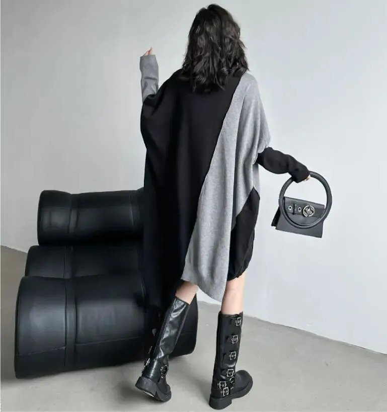 Stylish winter sweater dress with long bat sleeves and color block design