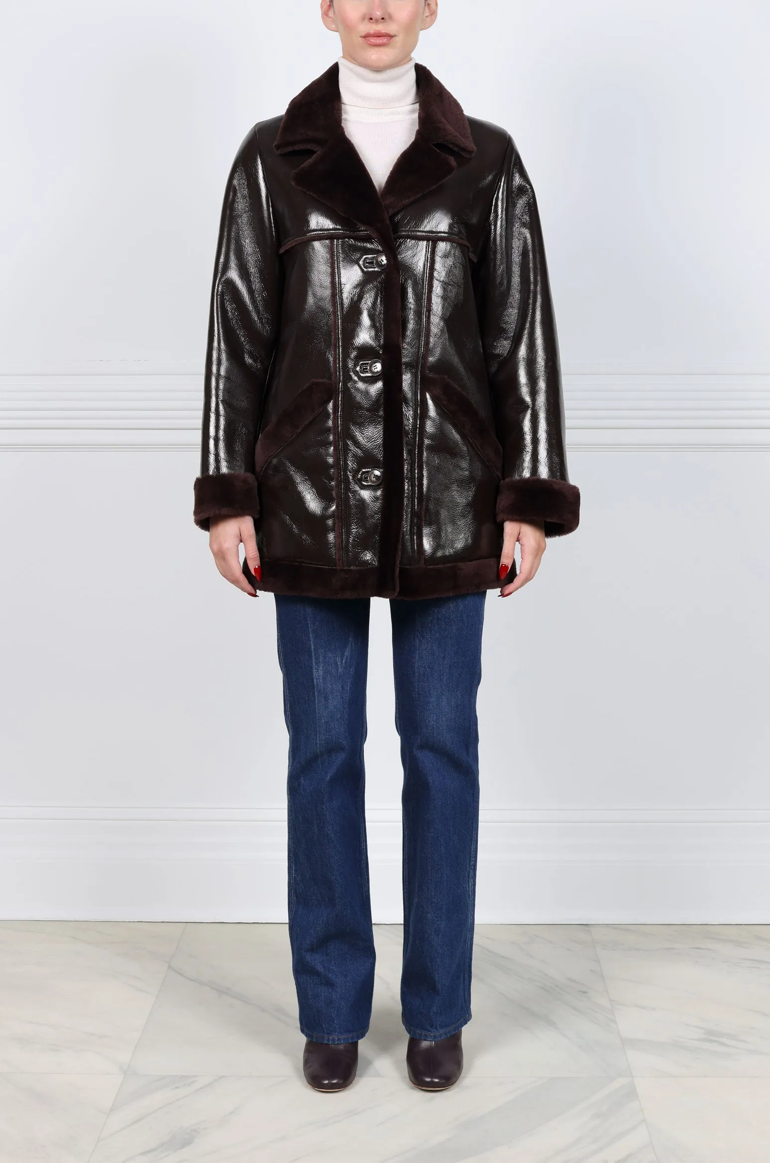 The Vermilion Patent Shearling Coat